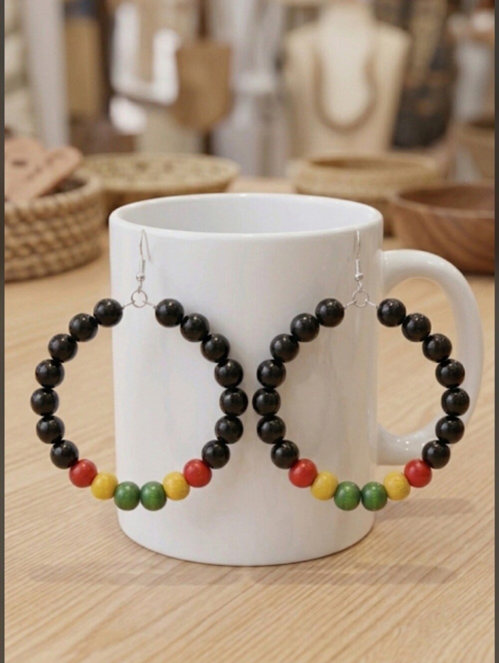 Elegant hoop earrings featuring Black and multicolored wooden beads. Their light - Picture 6 of 7